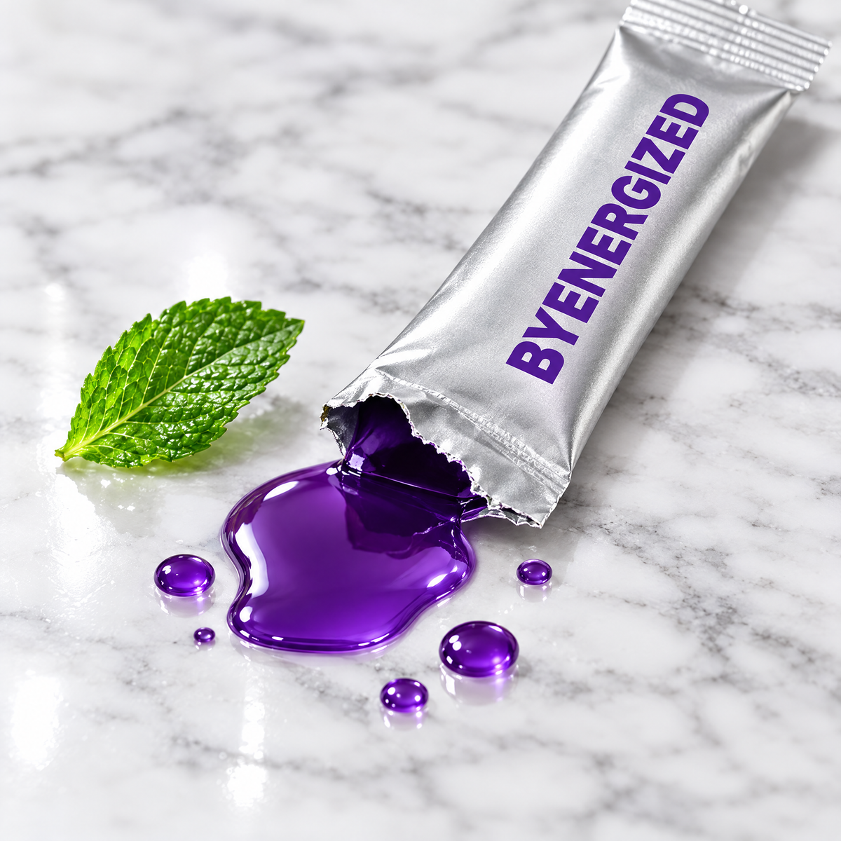 Torn Byenergized sachet with violet mouthwash liquid on white marble beside a mint leaf