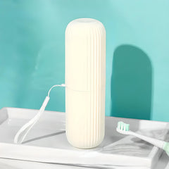 Travel toothbrush case standing on a bathroom tray