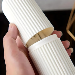 Hand opening the two-piece travel toothbrush case